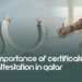 Importance of certificate attestation in Qatar, featuring Qatar's iconic architecture and a person signing documents, highlighting the need for document authentication for legal, educational, and professional purposes in Qatar.