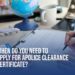 Applying for a Police Clearance Certificate - Desk with globe, Eiffel Tower model, airplane, and documents being filled out. Learn when to apply with Helpline Group.
