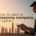 A professional man in a suit holding documents while standing against a city skyline backdrop, with the text 'How to start a Freezone company in Qatar?' overlayed.
