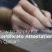 A person is filling out a form, with the text "How to Apply for Certificate Attestation in Qatar?" overlaid on the image.